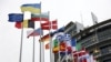 FRANCE – The Ukrainian flag next to the EU flag near the European Parliament building. Strasbourg, France, April 5, 2022